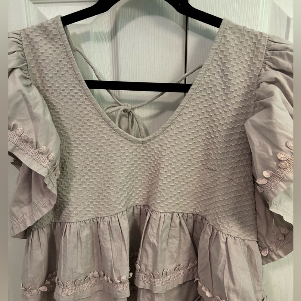 Nude Tan Anthropology Short Sleeve tie back shirt in size small